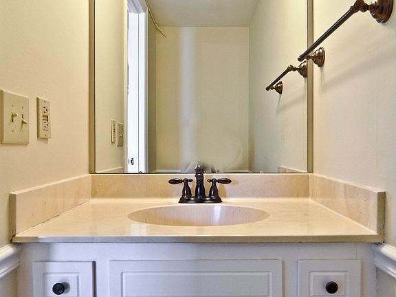 Charming powder rm. w/ new faucet, towel bar  &lighting.