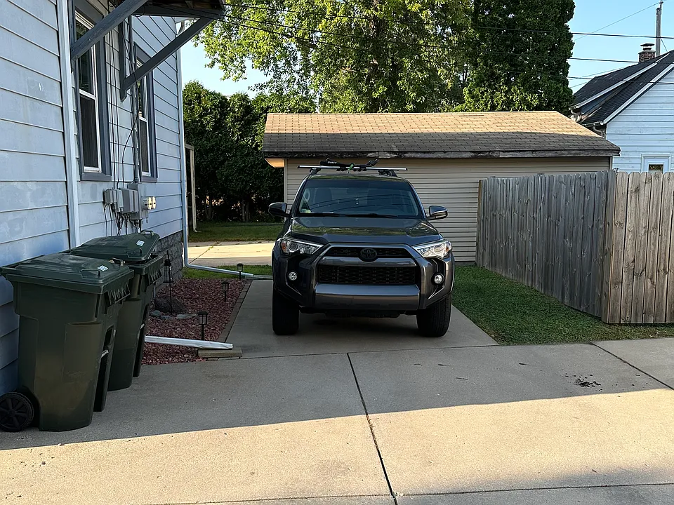 Here is another photo of the spacious parking space for upstairs tenants. There is also a shared fenced-in area in the backyard.