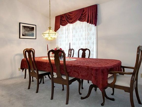 Formal dining room accommodates extra large table and chairs for those special dinners! Picture window allows for lots of natural light!