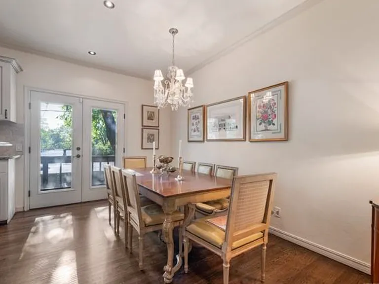 Dining room on entry level with French doors out to balcony