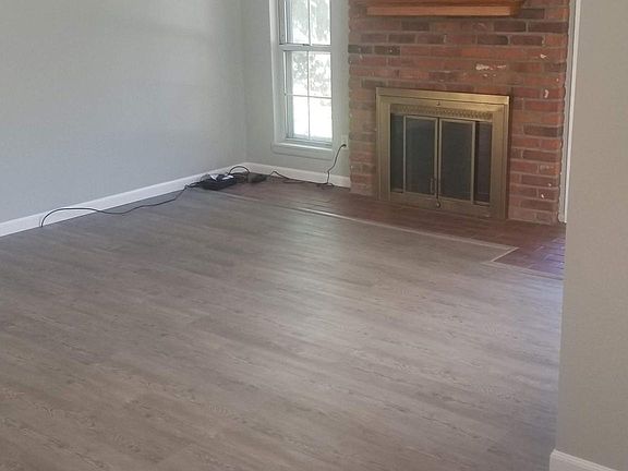 Living Room with new paint, flooring and window coverings