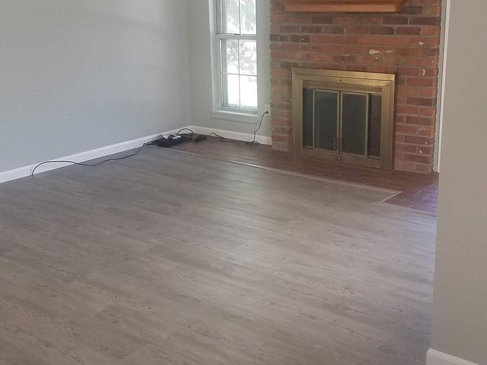 Living Room with new paint, flooring and window coverings