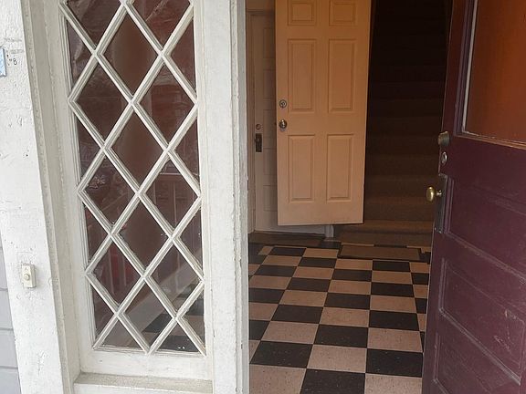 Apartment enters from front porch into hallway.