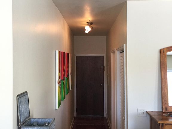 Hallway from kitchen looking at door