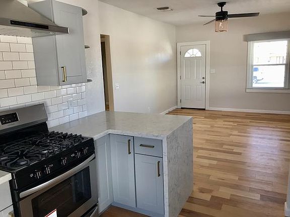 Bright and airy chefs kitchen open to the living room