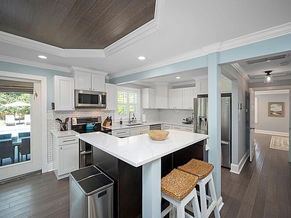 Fully stocked kitchen with bar stool seating for two