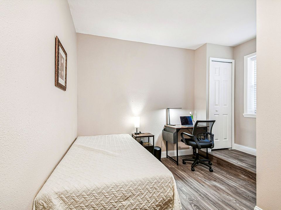 Twin size cozy full size bed, with end table, light, desk, office chair and light, storage container under the bed and closet