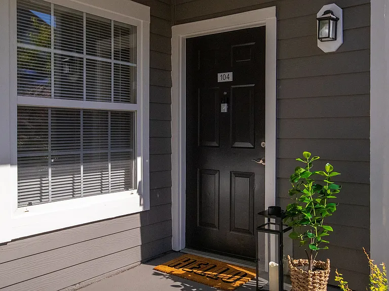 This inviting gateway is your personal retreat, a space where the outside world stays behind, and the comfort of home welcomes you with open arms. It's a cozy and welcoming entrance providing a sense of privacy and security.