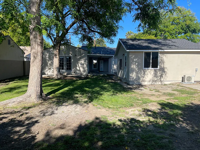 Large backyard with two patio areas. Great for pets and entertaining.

Detached garage with door access, lots of natural light and Air Conditioning.