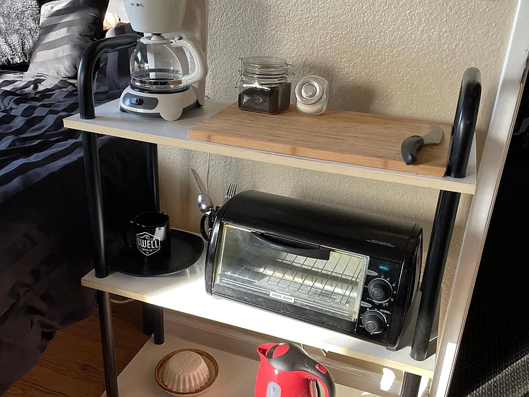 Kitchenette - toaster over, coffee maker, electric kettle, cutting board