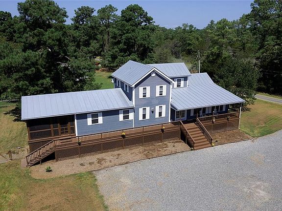 Front porch connects to the side screened porch.