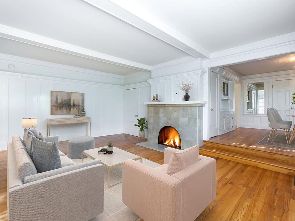 Living room has a decorative fireplace
