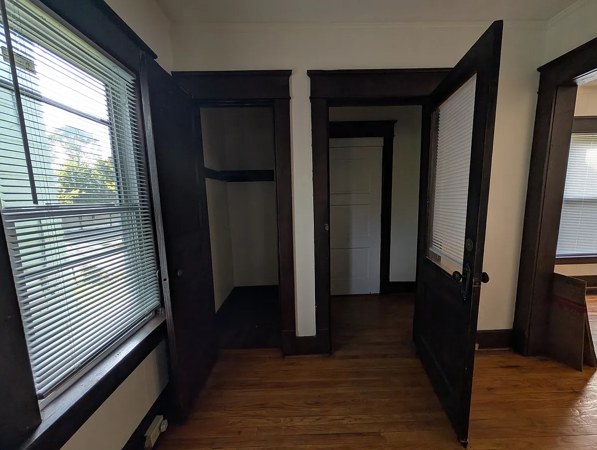 Front door includes entry way with an additional storage closet to the left. - 213 W 20th St