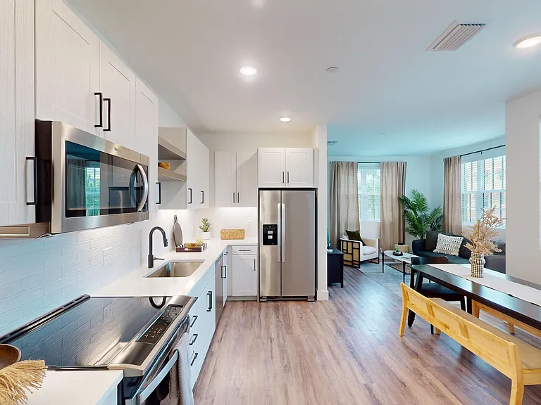 Whirlpool stainless steel appliances Side by side fridge with ice and water in door. Recessed lighting. Under cabinet lighting. White subway tile backsplash. Black matte hardware