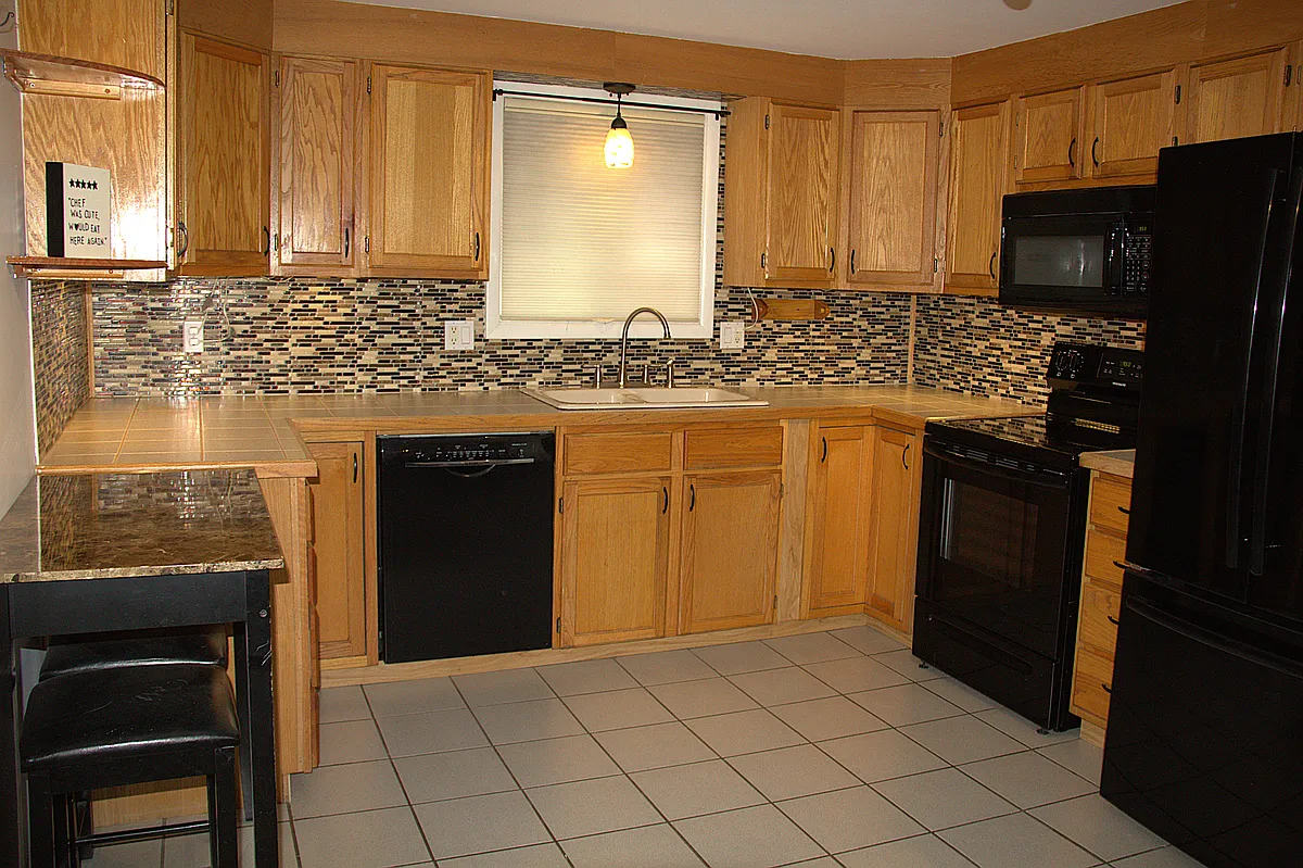 Kitchen with newer appliances - 6025 Venus Ave
