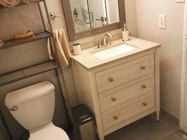 The bathroom is only 3 feet away from both bedrooms, and it has plenty of room for whatever is needed in a bathroom!