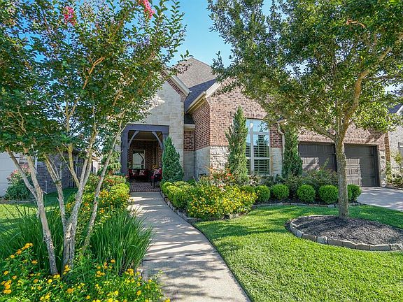 Youâll love coming home to this exquisite property. The gorgeous entryway and multitude of picture windows make this stone and brick home a stunner from every angle.