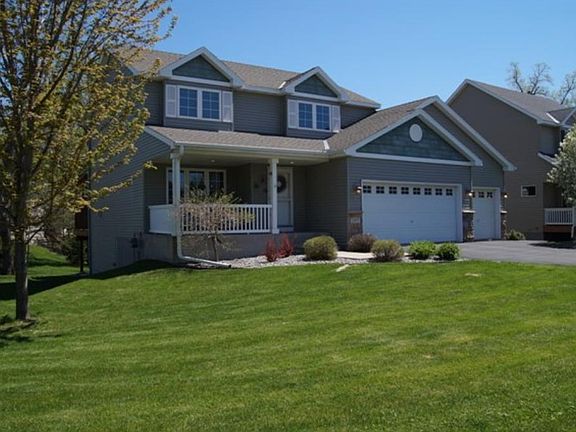 Large open kitchen area with lots of counter space, quality cabinets and lots of light and stainless appliances.