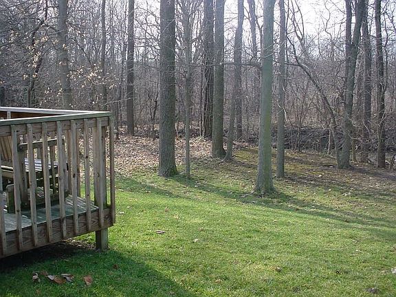 Wooded lot also has quaint stream running behind property. Very peaceful and quiet!