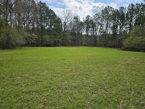 The former pastureland is used to grow hay. There are multiple fields scattered throughout this property.