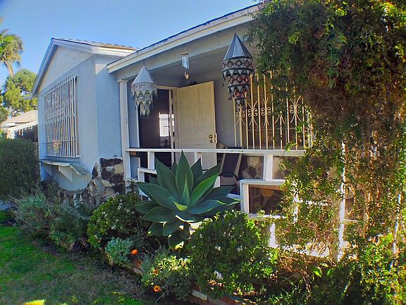 Front entrance. The window to right of door is the available room.