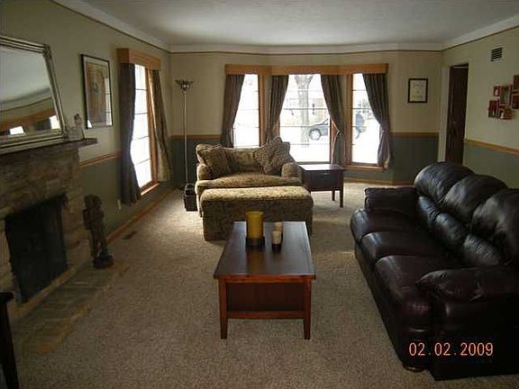 Large LR with fireplace, window treatments are new and stay with home