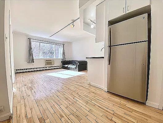 2nd image of 319 E 8th St APT 2A