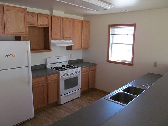 Spacious kitchen with lots of cabinet space and a walk-in pa
