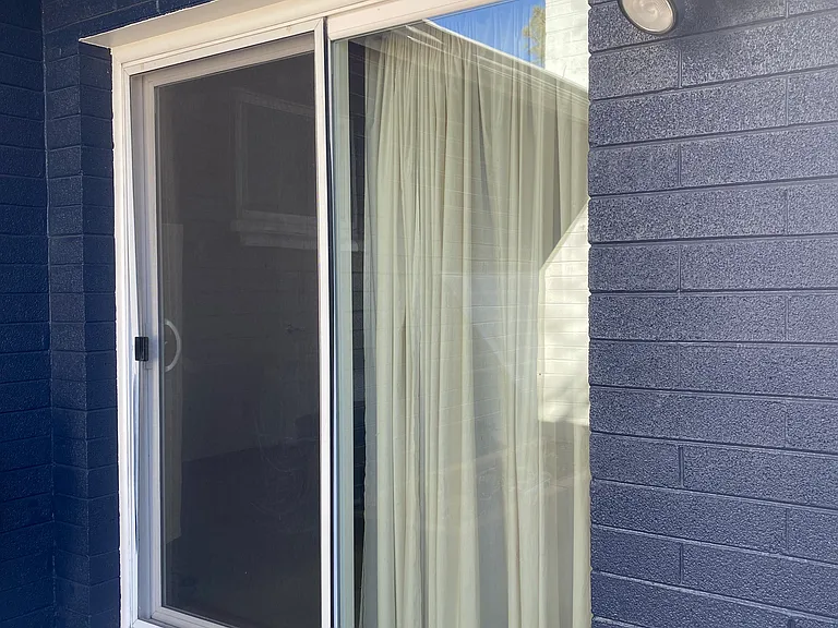 Sliding Glass door entry through the back yard.