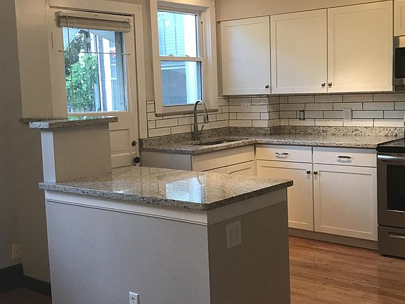 Updated Kitchen with Granite counters, White Shaker Cabinets and Dishwasher!