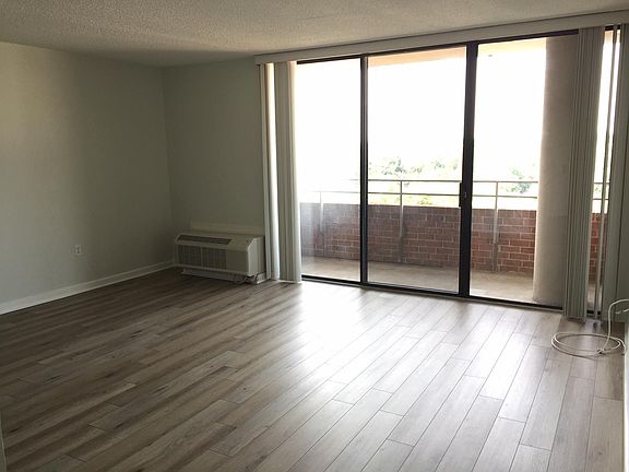 living room area leading to 9th floor balcony