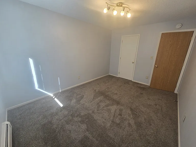 Bedroom one/Master bedroom with door on left to walk-in closet.