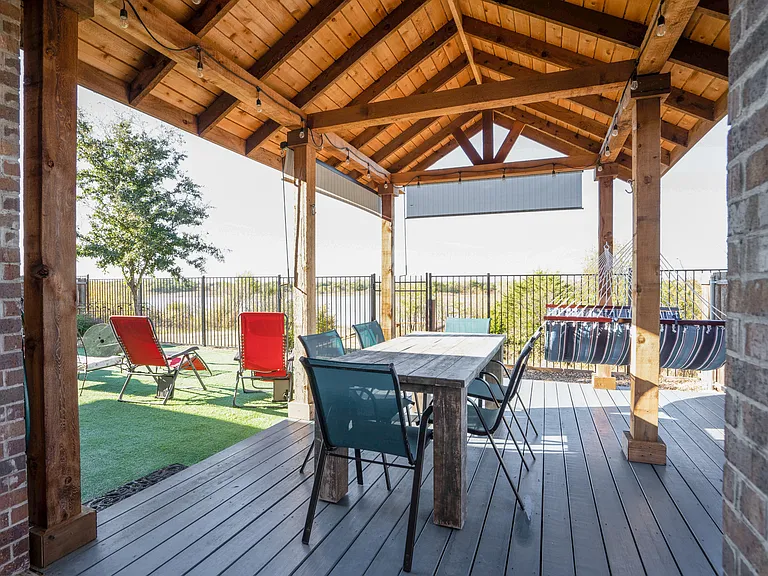 Our backyard oasis! Lake just beyond the wrought iron fence, offers great views and sunsets.