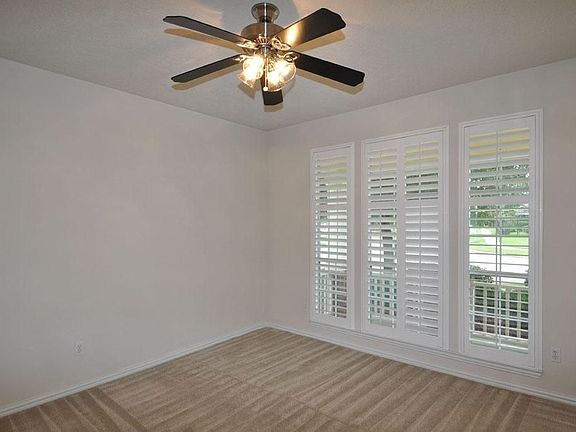 Time to study?  Work from home? Secondary living area?  Enjoy the view from this room.  Features Plantation shutters, updated ceiling fan, professionally cleaned carpets and a french door entry.