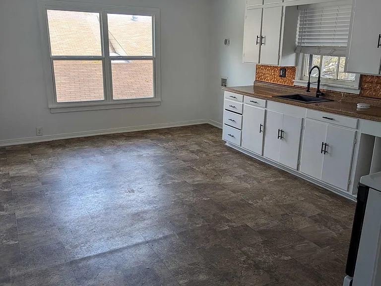 Large kitchen space which can easily be multi-purpose. Unit comes equipped with oven, fridge and laundry hook ups.
