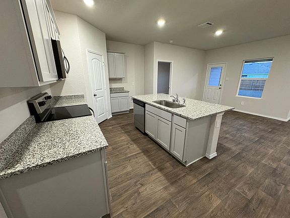 Kitchen with Granite Breakfast bar! also has a Breakfast/Dining area