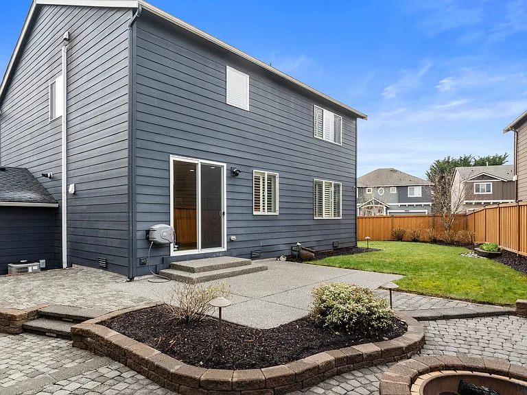 Back patio and fully fenced yard