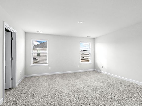 The primary suite offers a private retreat.