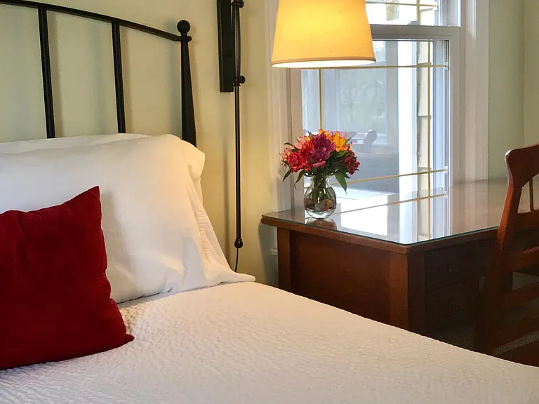 The back bedroom faces south and looks out onto the privacy of the backyard.