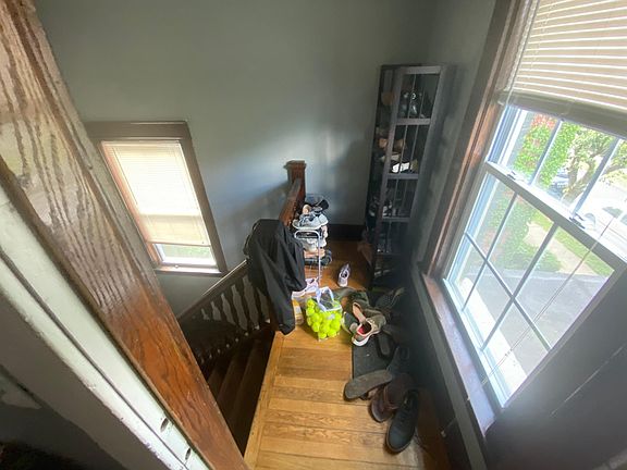 Stairwell with space for shoes, coat rack