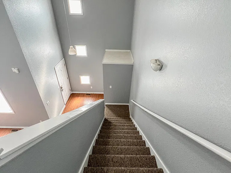 Looking down toward the front door from the second floor.