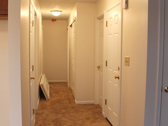 Hallway at top of stairs looking towards bedroom and master