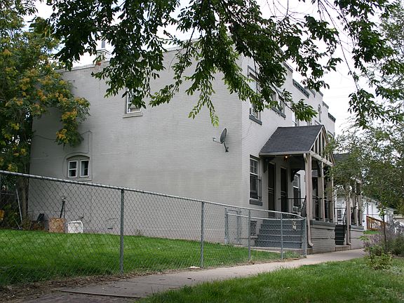 extra large fence side yard shared with other units with rasberry bushes