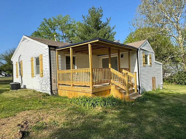 View of back of house and covered deck