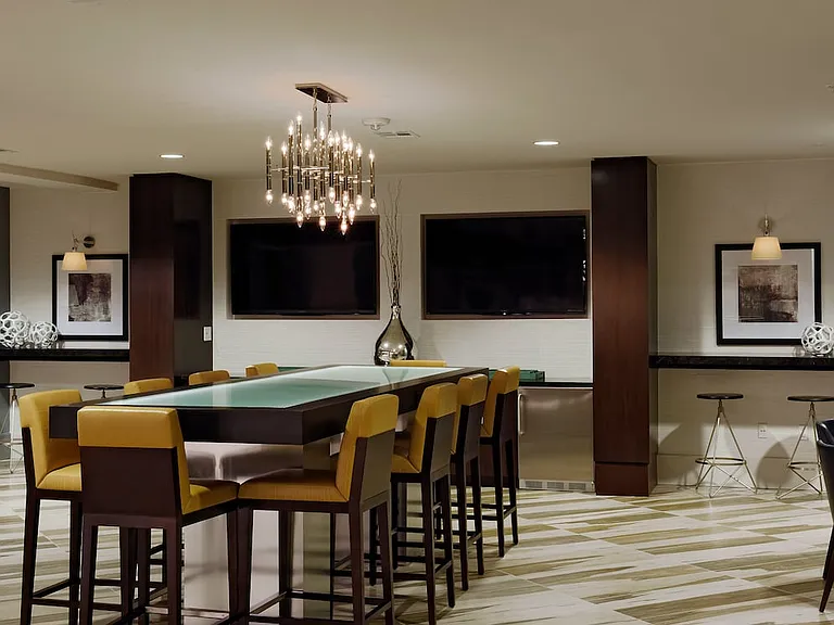 Lobby with seating and flat screen televisions