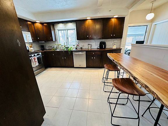 Kitchen from living room entrance - sunroom just beyond kitchen on your right