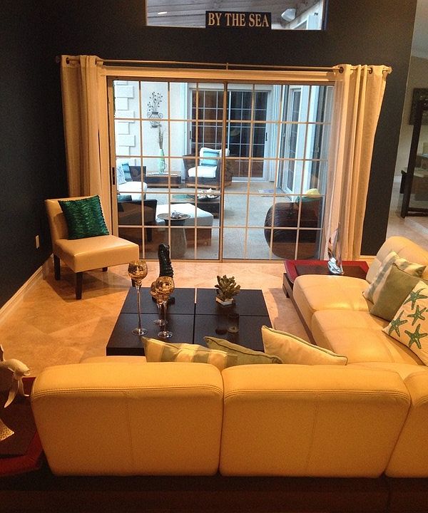 Living Room
						:
						Room has 10' sliding glass door with view of pool and outside covered terrace.