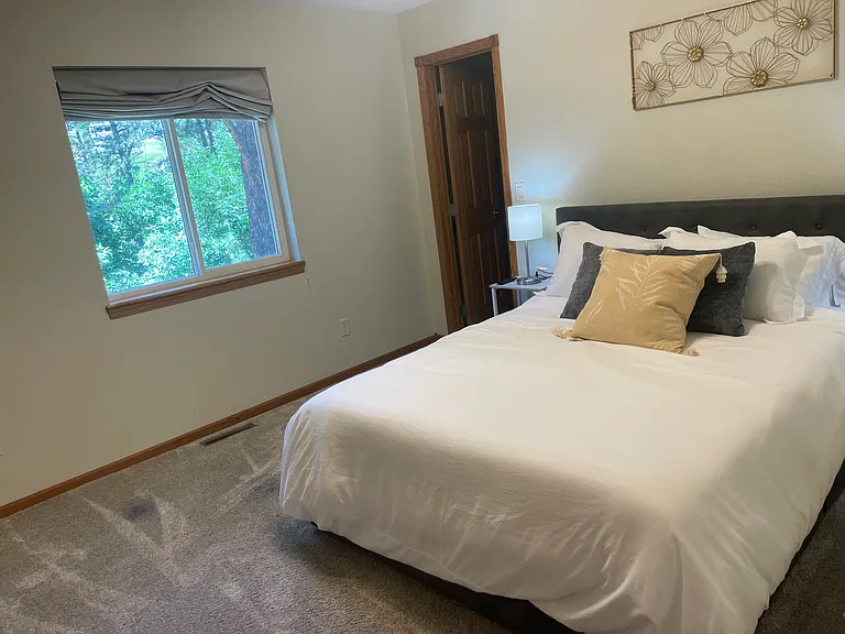Second bedroom on upper level - doorway pictured is to walk-in closet.