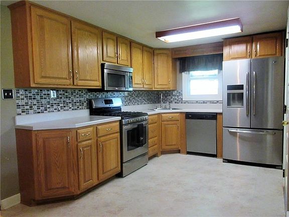 The kitchen is filled with sleek updates and is attached to the dining area.