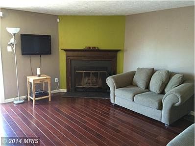 Large open living room w/wood burning fireplace